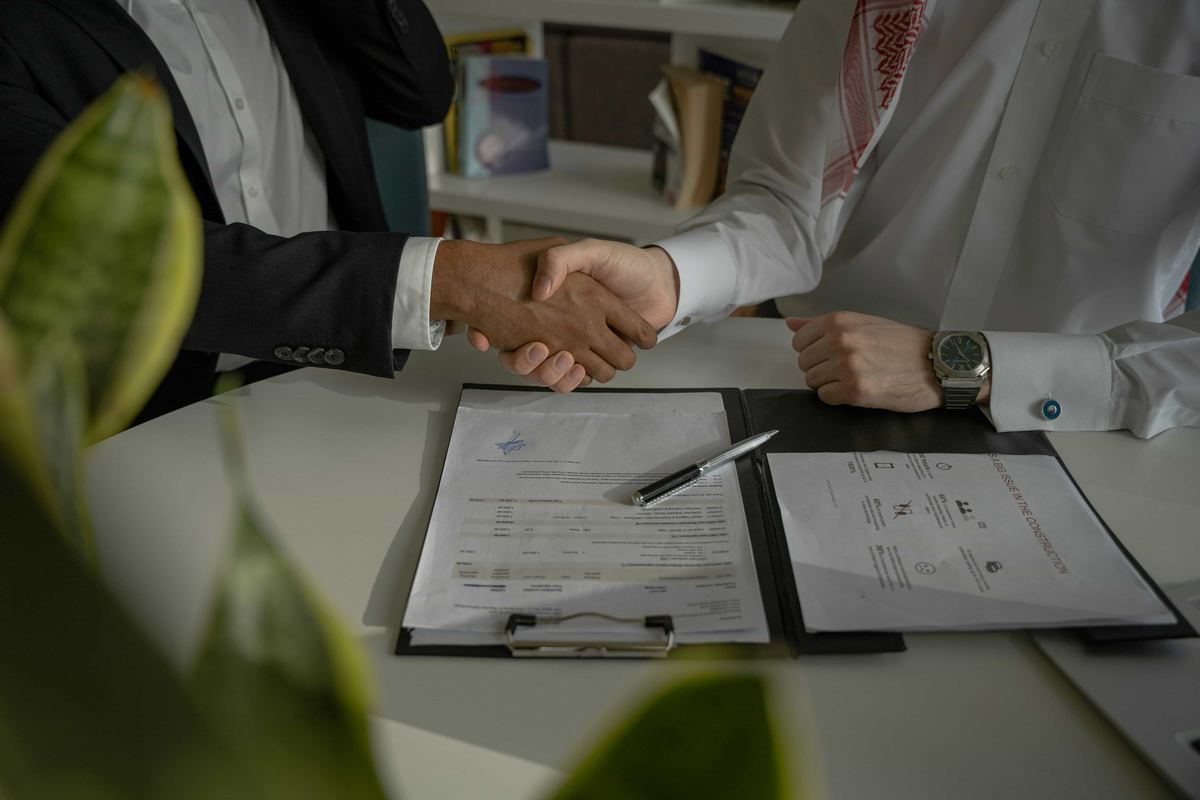 Handshake at a meeting table